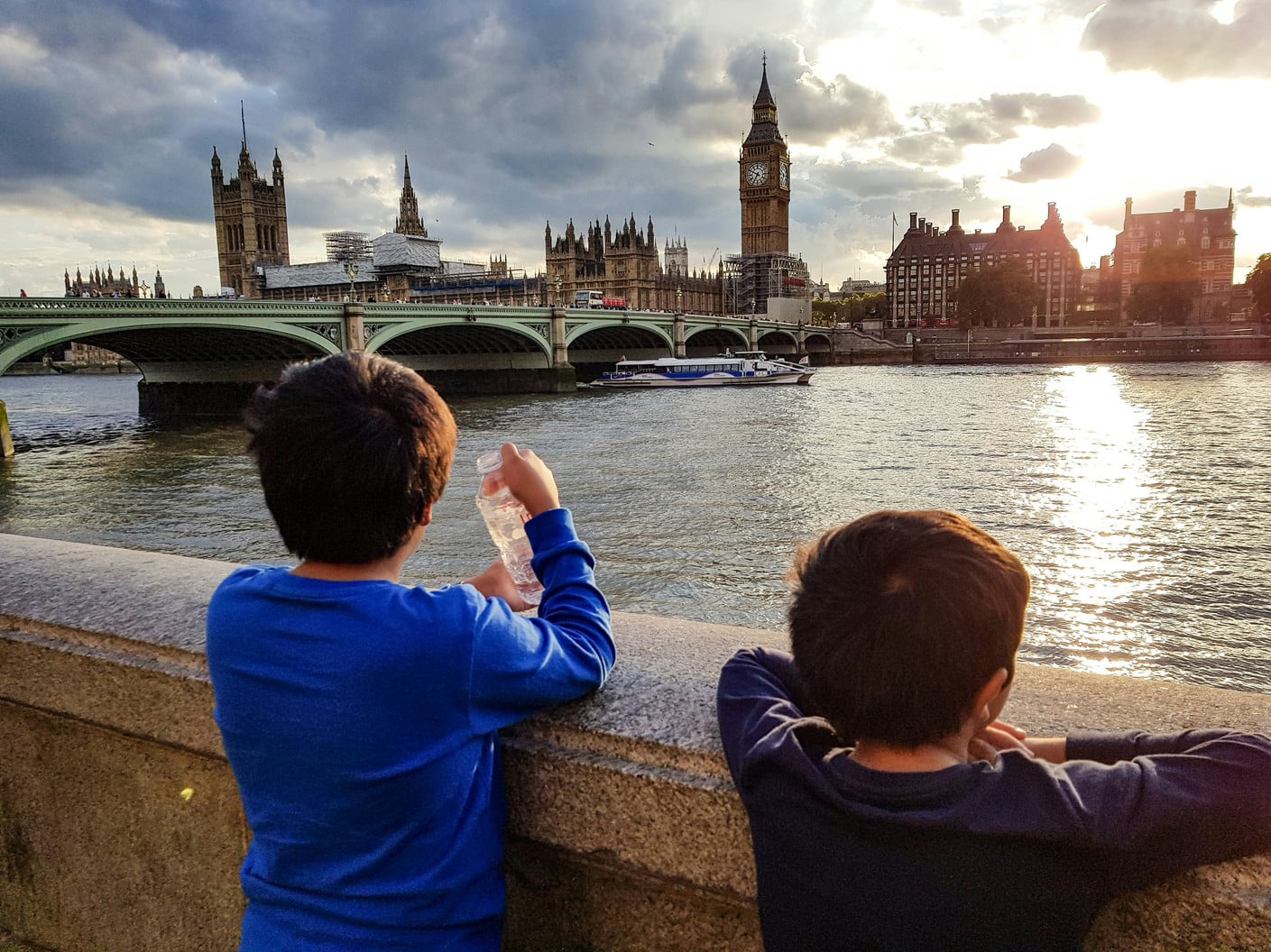 Two boys looking out at Big Ben and Westminster Bridge, one of many things to do with kids in London